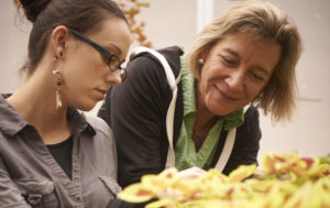 horticultural therapist libba shortridge HTR works with client in greenhouse