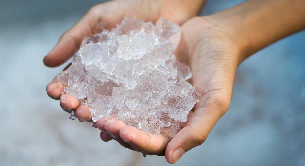 hand holding ice to prevent cutting