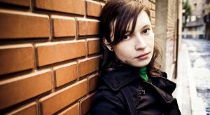 young woman with depression looking at camera