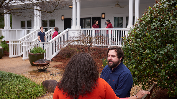 south campus exterior with people in courtyard