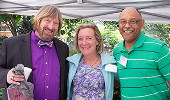 three people attending arts in the garden