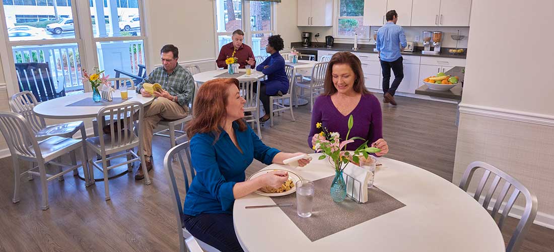 people in dining room at south mental health residential campus