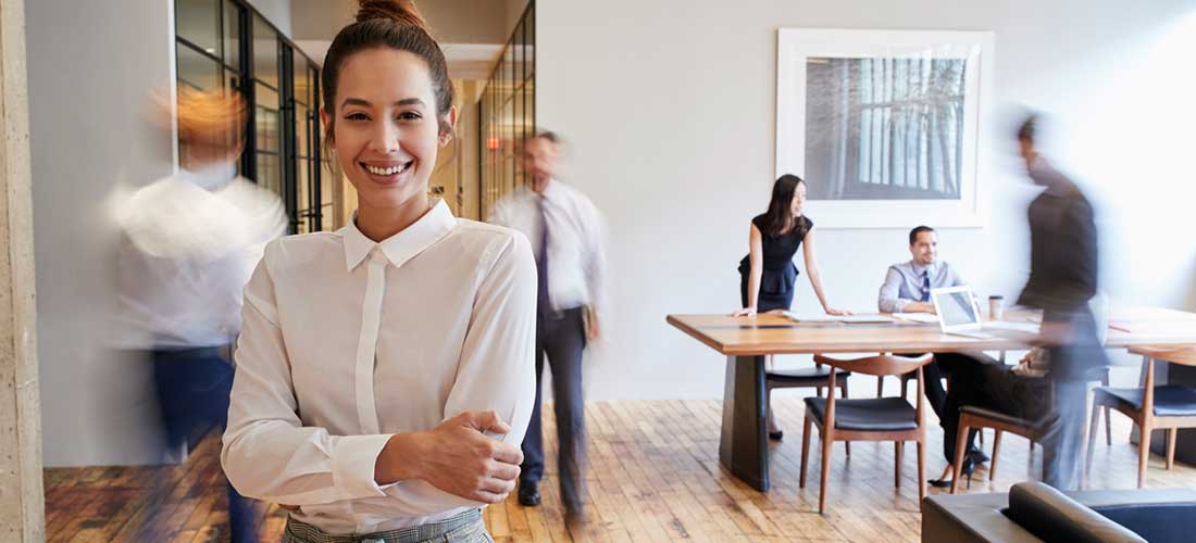 smiling woman standing in office