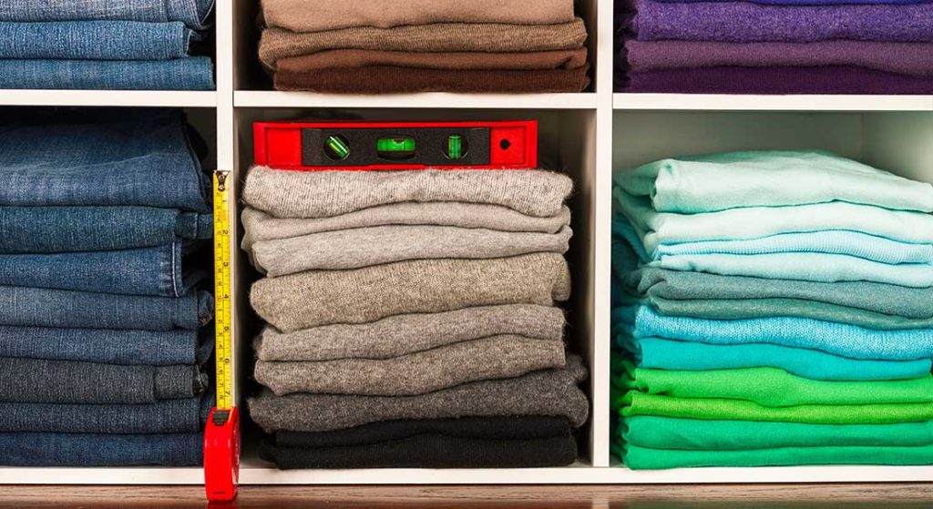 clothes organized on shelves by color in equal heights