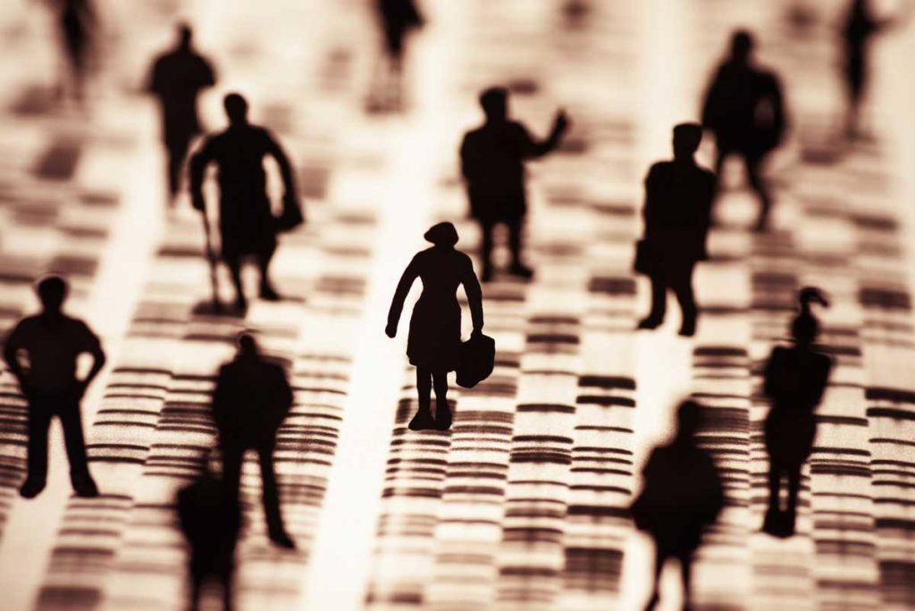 silhouette people on strips of genetic code