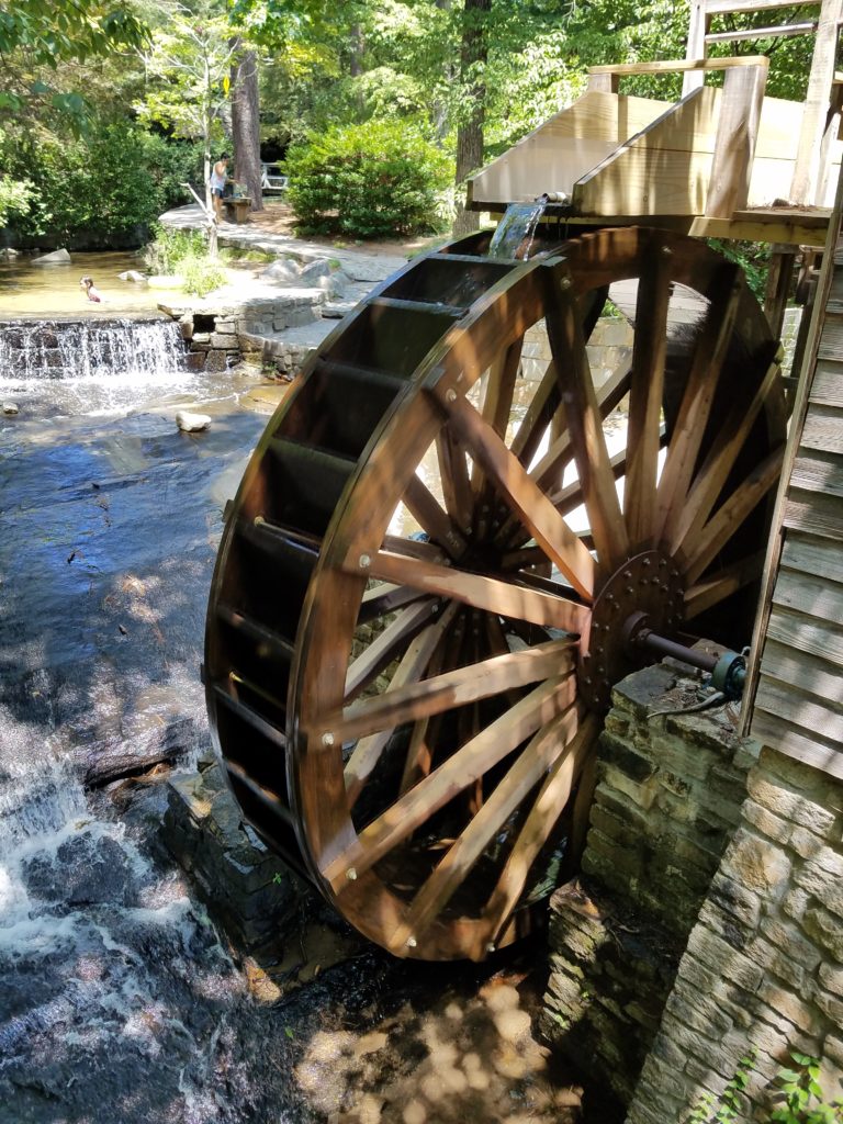 a photograph of a water mill