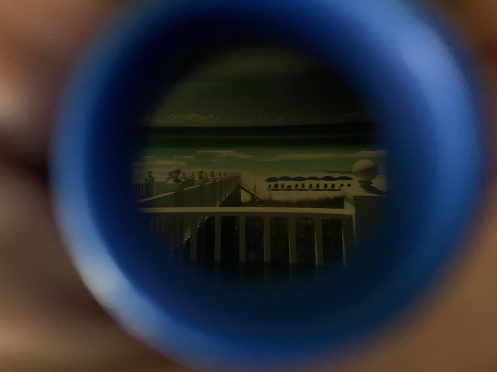 A beach seen through a lens