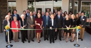 Skyland Trail leadership cuts ribbon to open the Rollins Campus for young adult mental health treatment