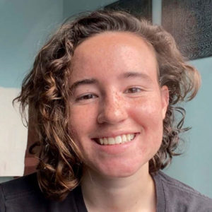 a woman smiling directly into the camera. a selfie.