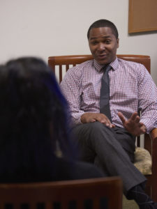 Dr. Adam Meadows speaks with a patient one-on-one during an appointment. (Photo from 2017)