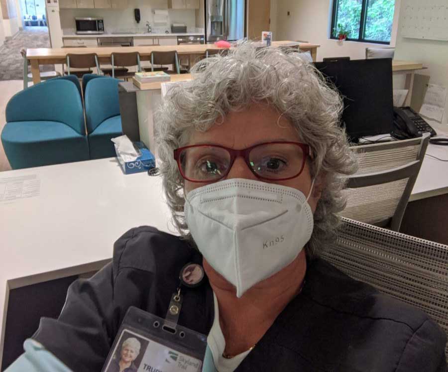 A photo of Trudy Farkas at her nurses station wearing a facemask during the COVID-19 pandemic
