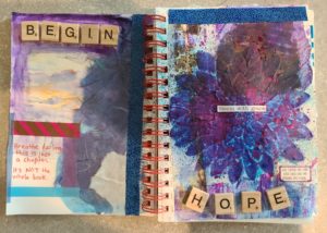 handmade journal from art therapy showing the words begin and hope with art