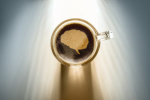 coffee cup from above with foam in the shape of a brain