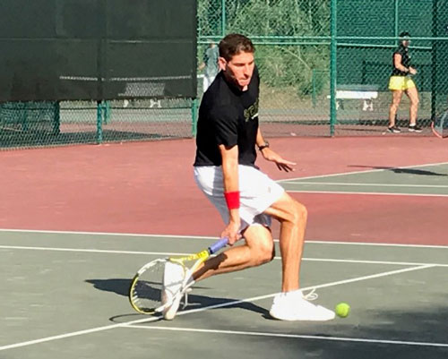 Q, a graduate of the Skyland Trail adult residential treatment program, playing tennis.