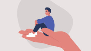 an illustration of a man sitting in the palm of a supportive hand