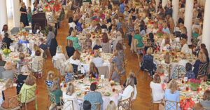 A ballroom filled with people sitting at rounded tables for the 2023 Associates Spring Luncheon