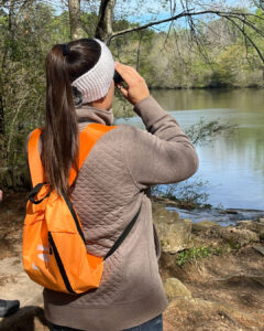 woman using binoculars for bird watching