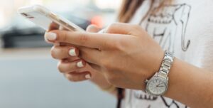 Woman holds a phone