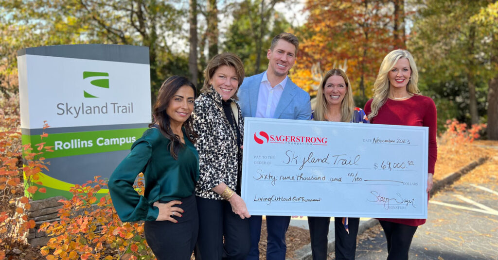 Representatives from the SagerStrong Foundation and Skyland Trail holding a check for $69,000