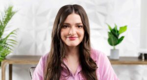 Smiling young woman with long brown hair