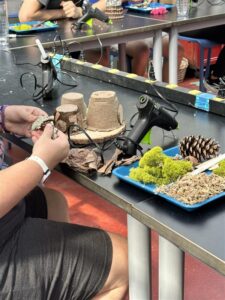 Skyland Trail client builds a fairy home for annual Fairies in the Garden event.