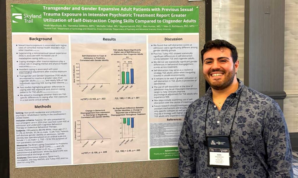 Man standing in front of research poster