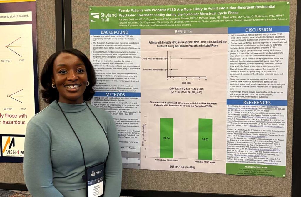 Woman standing in front of research poster
