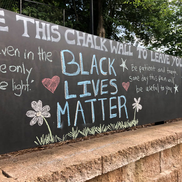 Black Lives Matter written on the chalk wall at Rollins Campus