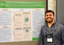 Man standing in front of research poster